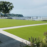 Pro-Trade Apple Professional Synthetic Turf 65 oz. Face Weight/86 oz. Total Weight 1.75 in. Apple Green Blades - Green/Brown Thatching