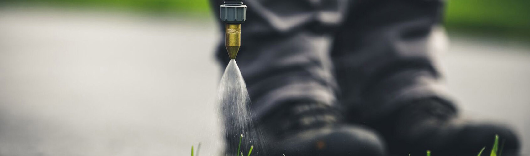 Closeup of spray nozzle spraying turf